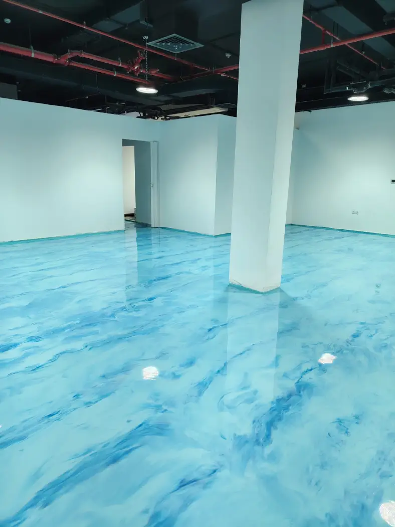 Blue marble effect epoxy flooring in a modern commercial interior